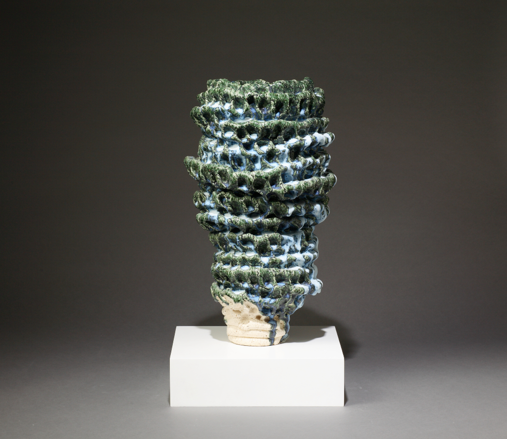 Photograph of an asymmetrical blue and green Japanese sculpture