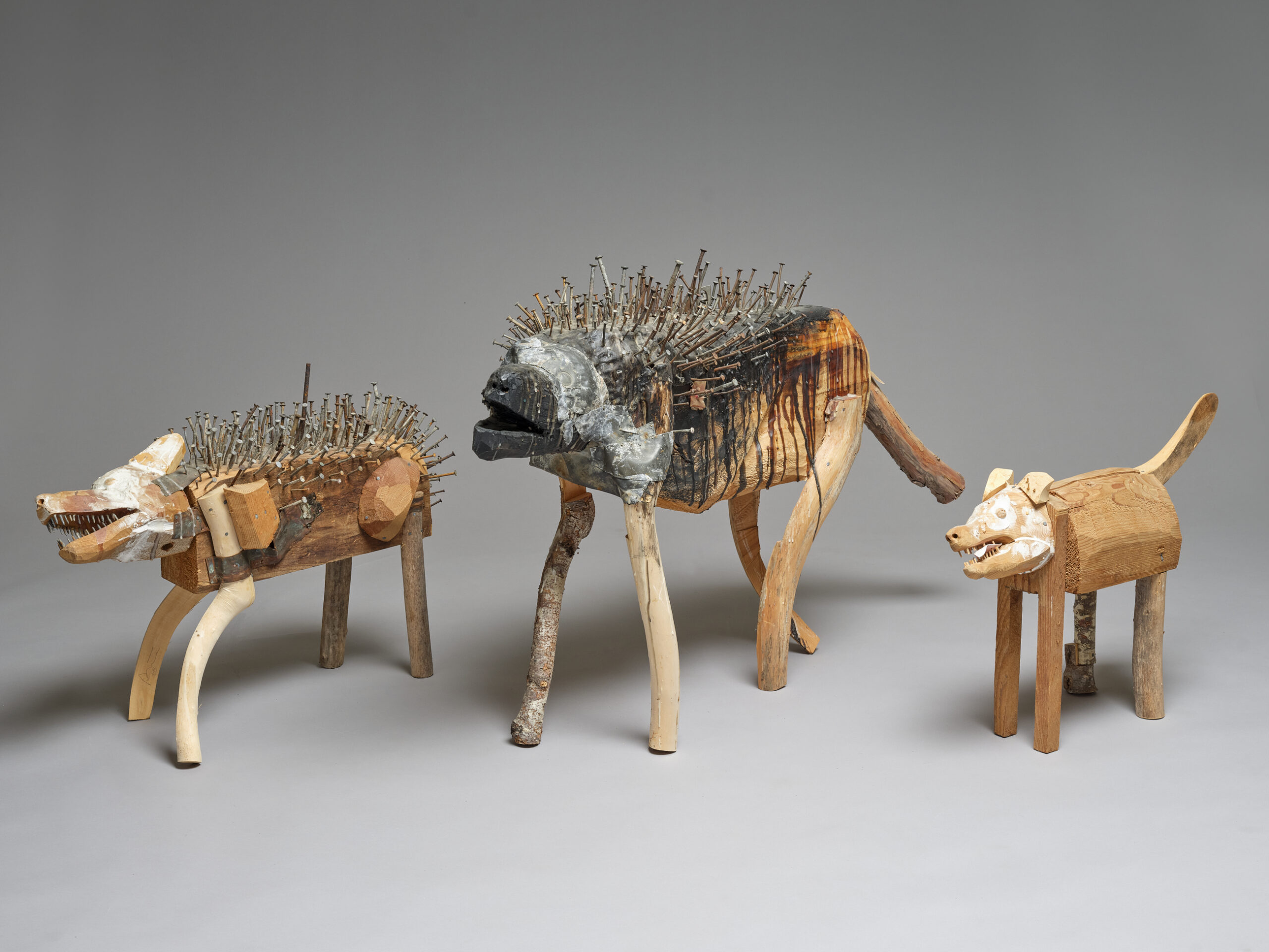 Three dog sculptures