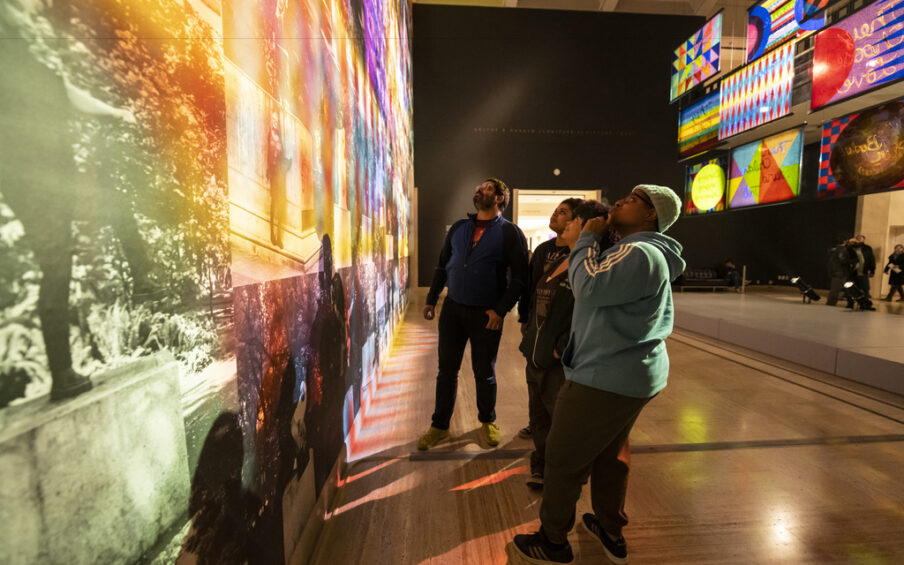People viewing art in a gallery.