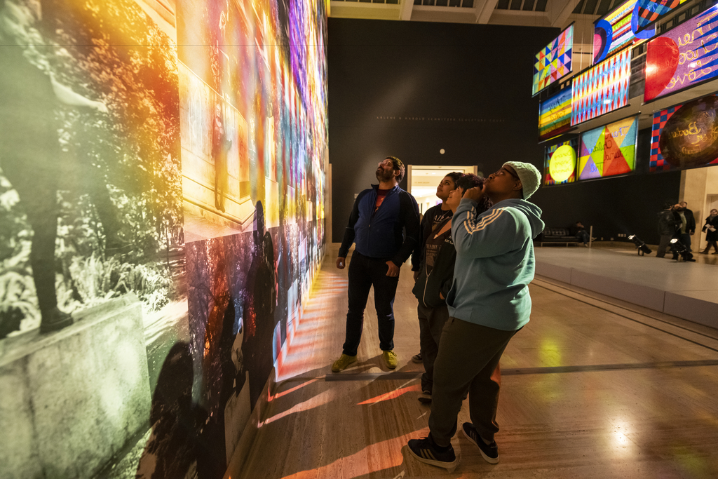 People viewing art in a gallery.