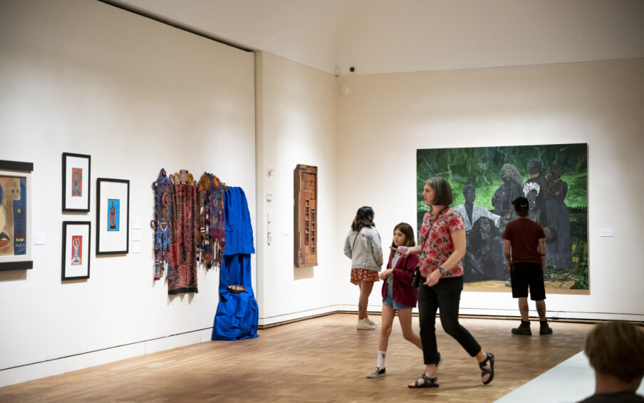 People walking around the Black Artists of Oregon gallery