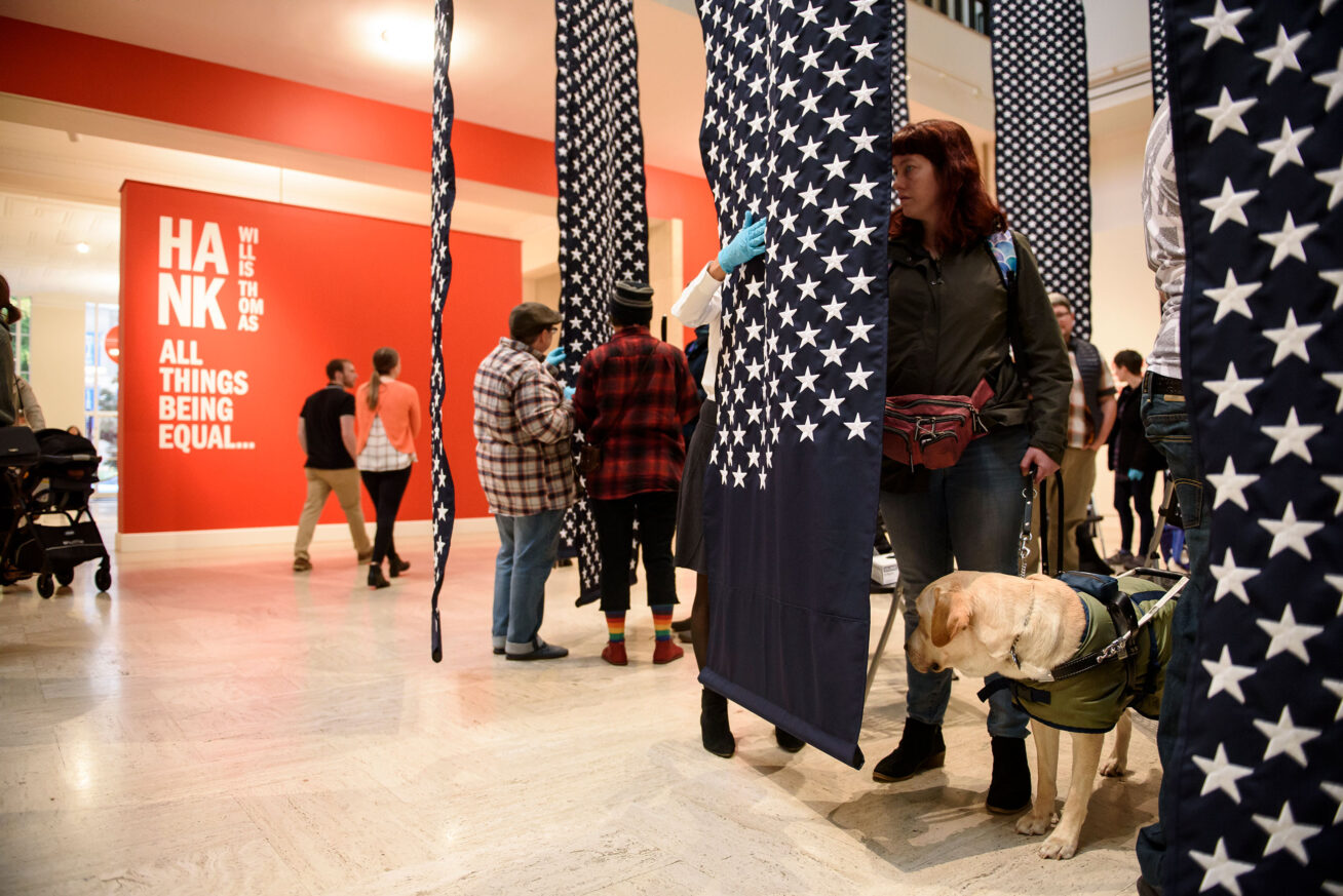 Low vision and blind Museum visitors experiencing artist Hank Willis Thomas’s “14,719.”