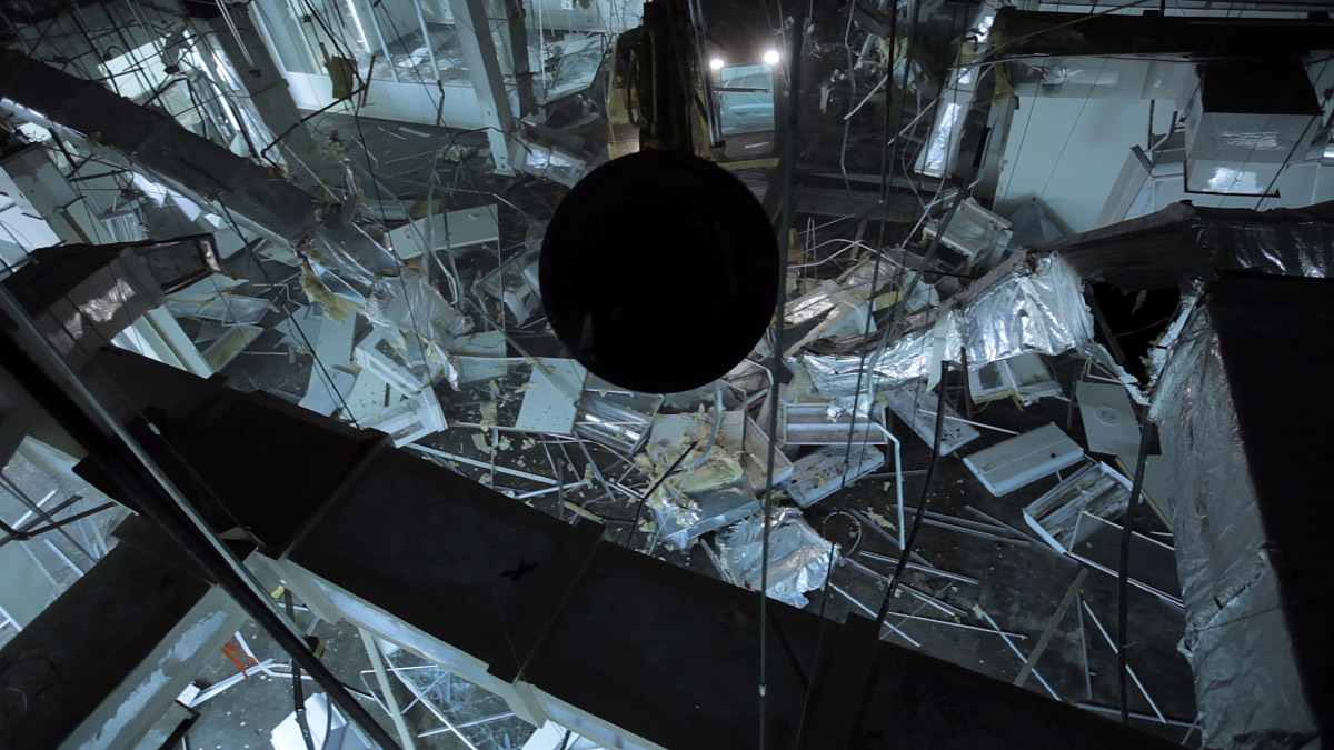 Photo from above of a room filled with broken computers and machines scattered on the floor