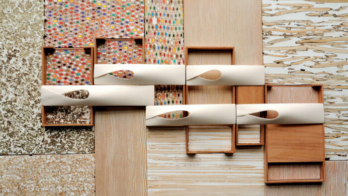 Photo of an arrangement of wood, colored pencils, plaster, and porcelain.