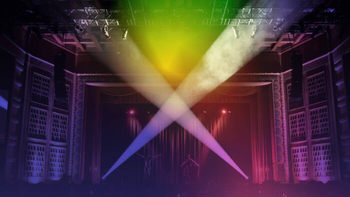 A colorful theater stage with two spotlights.