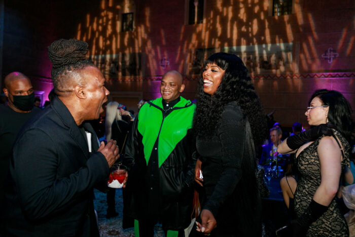 Three people laughing and smiling at the Cinema Unbound Awards ceremony