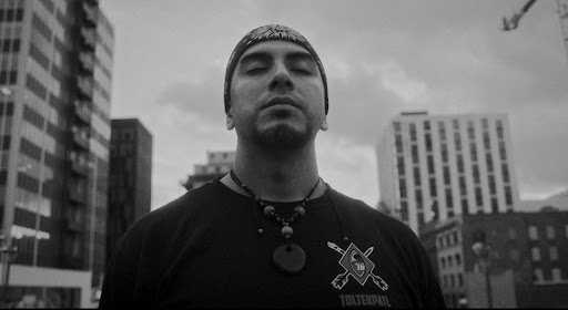 Black and white portrait of a man looking up into the air.