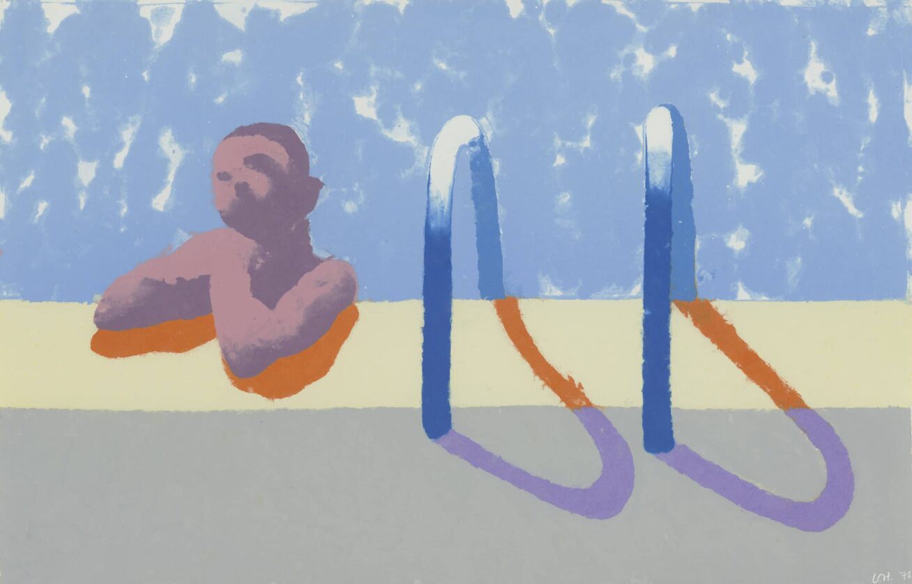 Person lounging in a pool next to a pool ladder