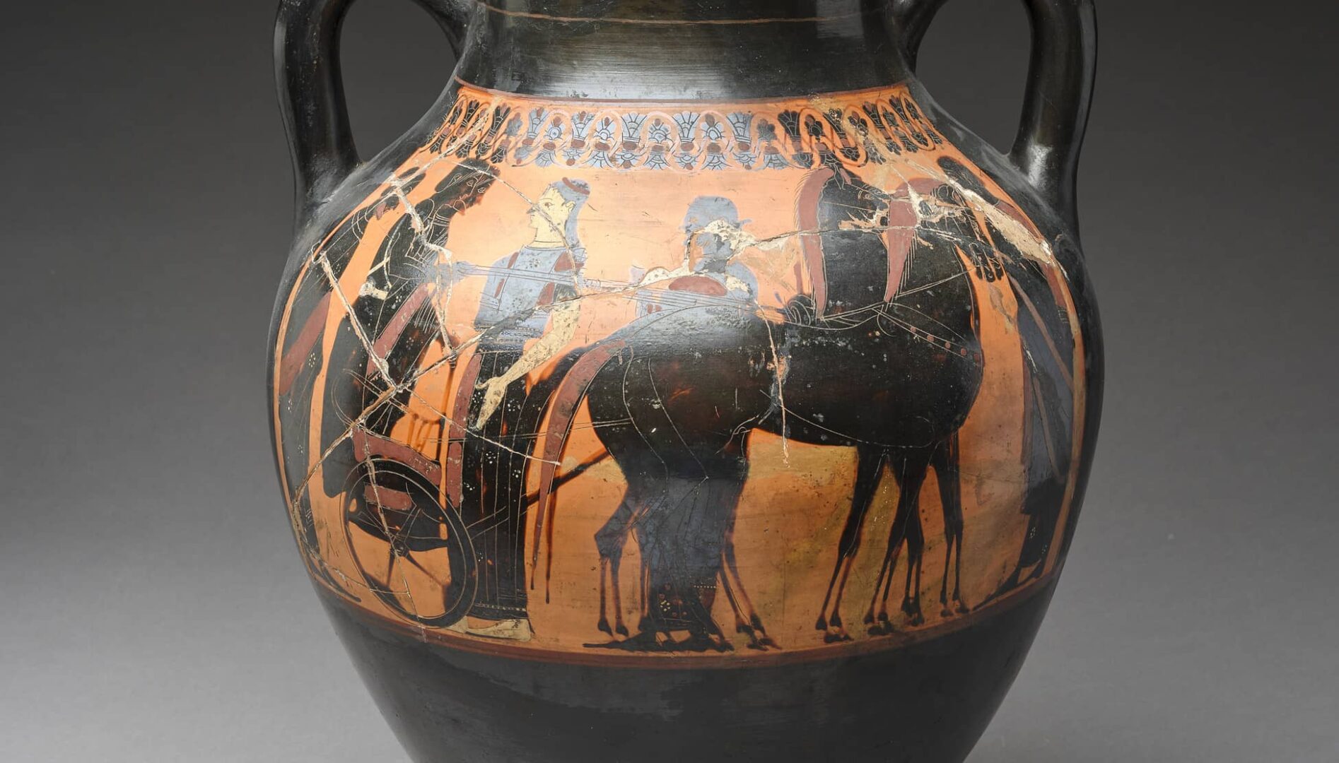 A terracotta amphora with several figures.
