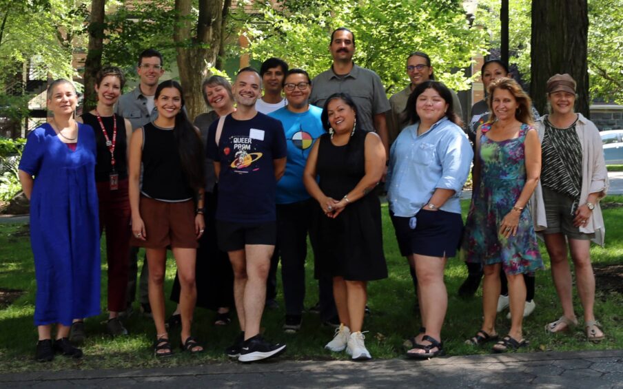 A group of people standing in a park.