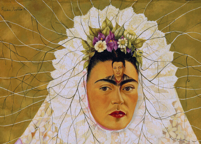 Painting of Frida Kahlo with a white veil and purple and white flowers framing her face and a small image of Diego Rivera on her forehead