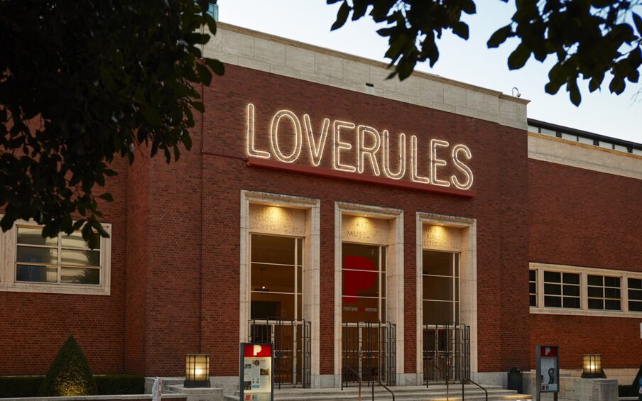 Museum exterior with Hank Willis Thomas LOVERULES art