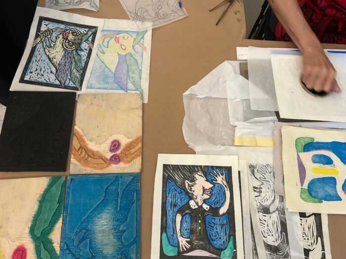 Woodblock printing supplies on a table.