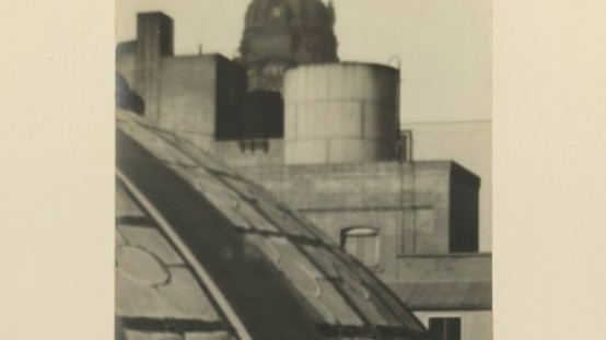 Sepia photograph of a skyline of buildings