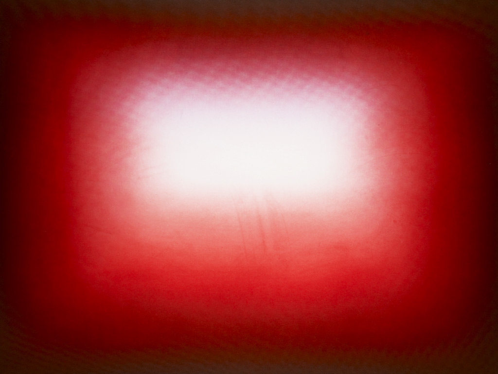 Etching in black and red with a rectangle of white at the center