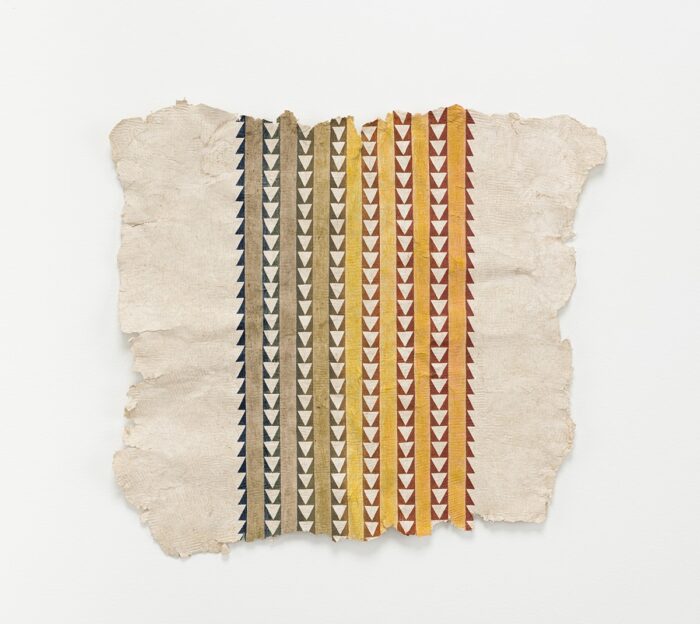 An artwork of alternating brown and yellow lines and lines of triangles with black backgrounds on a natural colored paper with rough edges