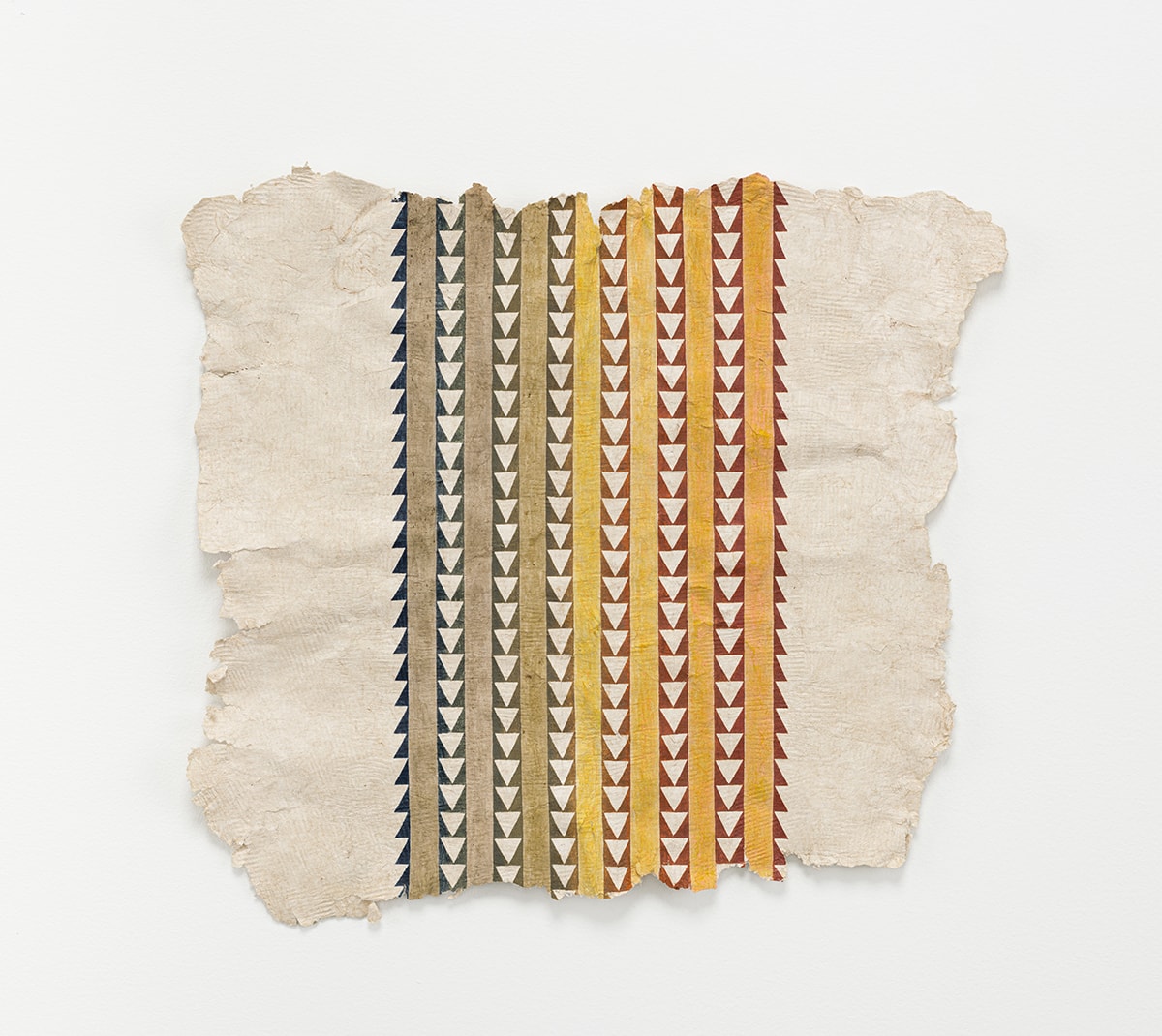 An artwork of alternating brown and yellow lines and lines of triangles with black backgrounds on a natural colored paper with rough edges