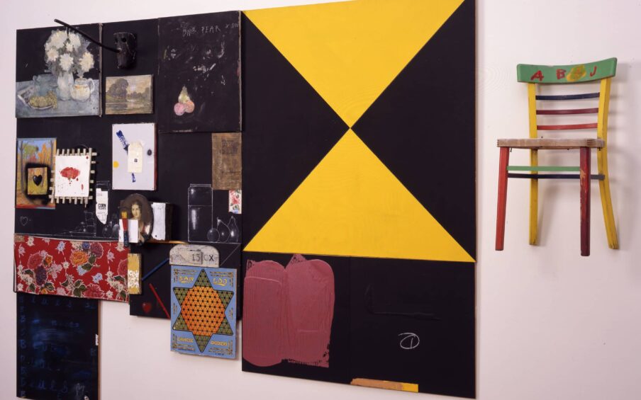 A multimedia art piece hanging on a gallery wall.