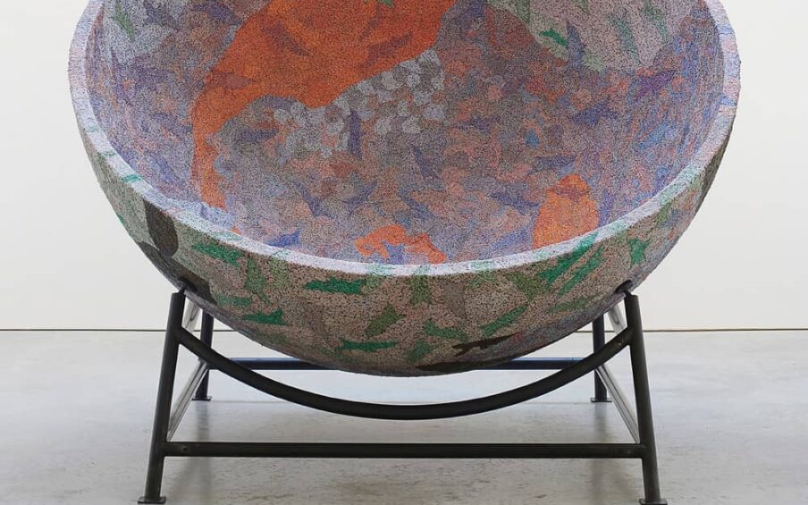 Large, colorful bowl on a metal stand.