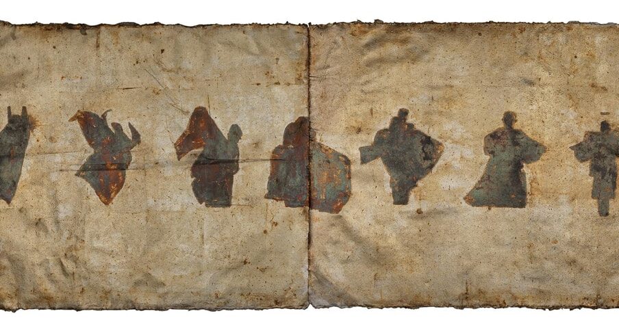 Image description: Emerging Zodiac, 2021, oxidized silver leaf and Renaissance wax on paper, 17 ⅜ x 42 in. Horizontal rectangular composition of 7 abstract human silhouettes in motion rendered in rusty brown, verdigris, purple, yellow against a blank background of 2 brownish patina paper with wrinkles and frayed or burnt edges. From left to right, the figures appear captured in motion, arms or legs outstretched and cloaked in a large garment that at times appears as wings.