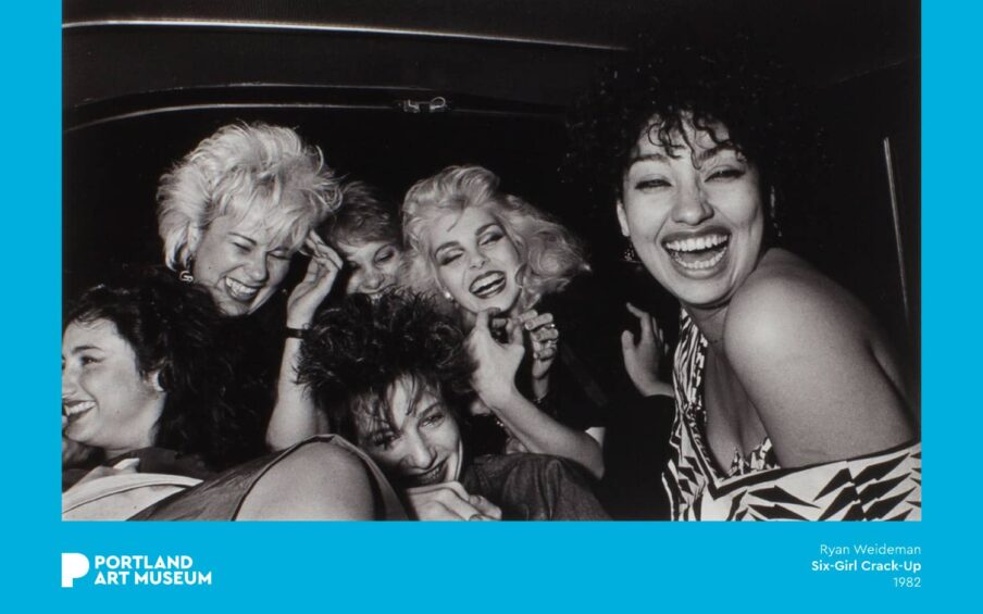 Black and white photograph of six people inside a vehicle.